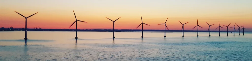 row of offshore windmills renewable energy