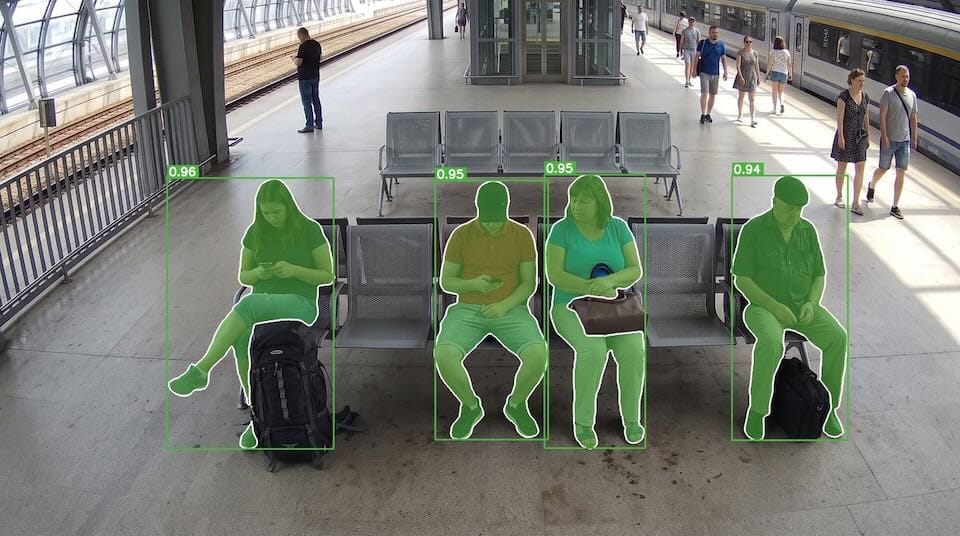 SAM 3 finding people - seated people identified with confidence score